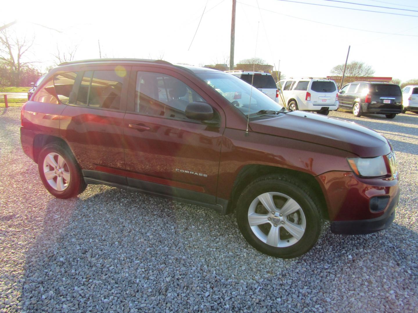 2016 Red /Gray Jeep Compass Sport FWD (1C4NJCBA3GD) with an 2.0L L4 DOHC 16V engine, Automatic transmission, located at 15016 S Hwy 231, Midland City, AL, 36350, (334) 983-3001, 31.306210, -85.495277 - Photo#0